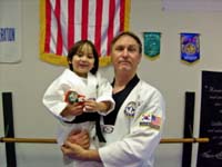 Master Gary White poses with his son.